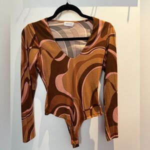 Vestique Roxanne Bodysuit
Size small Faux leather